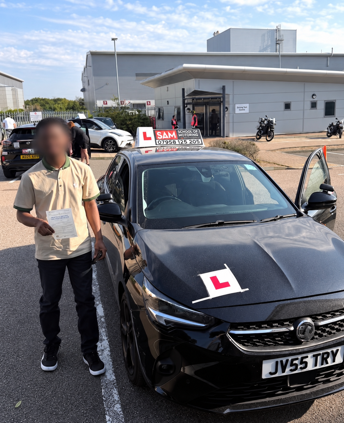 Learner holding their driving test pass certificate